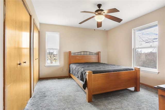 bedroom with carpet flooring, a ceiling fan, and baseboards