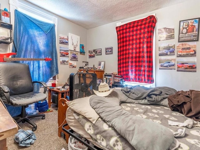 carpeted bedroom with a textured ceiling