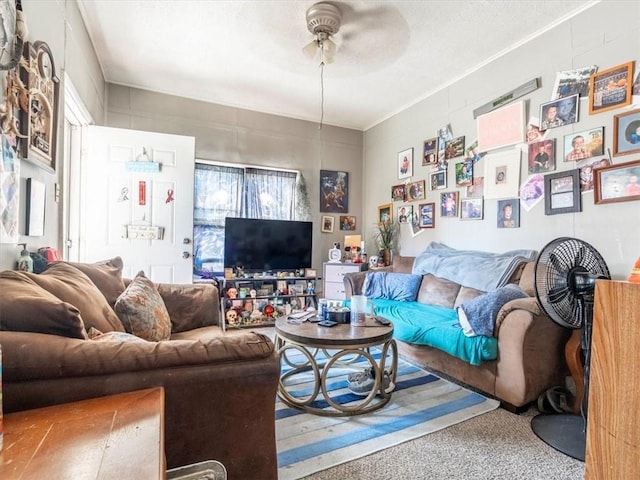 living room with carpet flooring and a ceiling fan