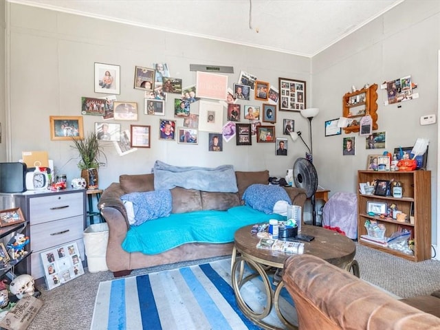 living area featuring crown molding and carpet floors