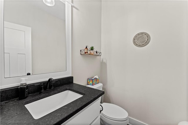 half bath with toilet and vanity