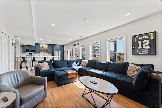 living area featuring recessed lighting and light wood-type flooring