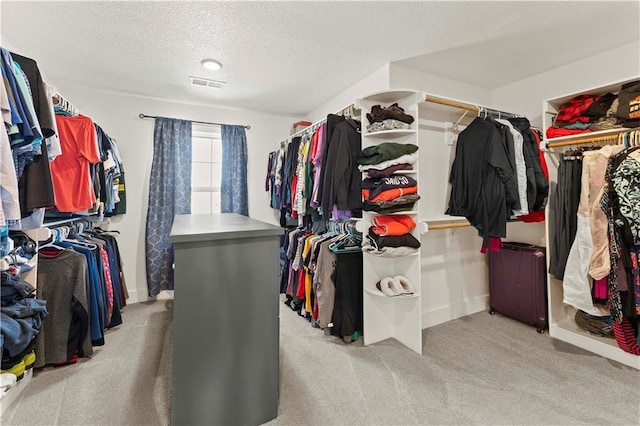 walk in closet with carpet and visible vents