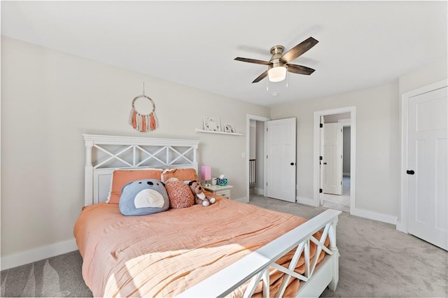 bedroom with ceiling fan, baseboards, and light carpet