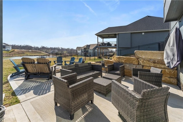 view of patio / terrace featuring an outdoor living space and fence