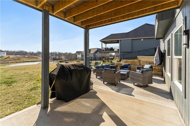 view of patio with grilling area, a water view, outdoor lounge area, and fence