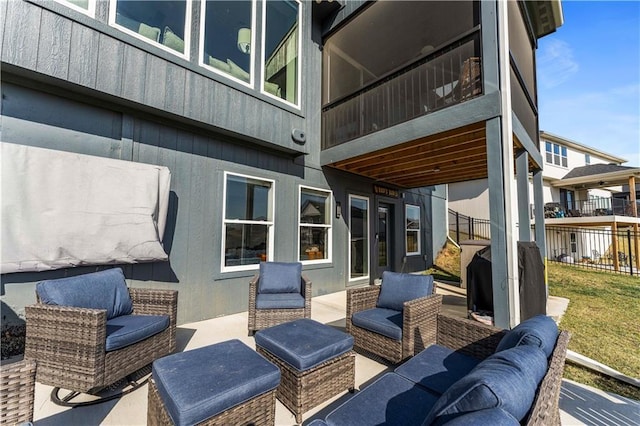 view of patio / terrace featuring outdoor lounge area and fence