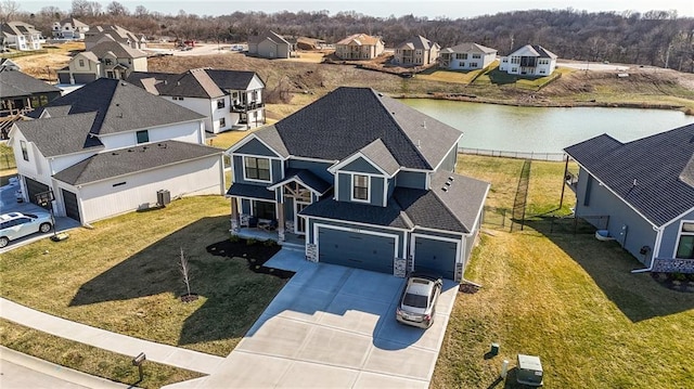 aerial view featuring a residential view and a water view