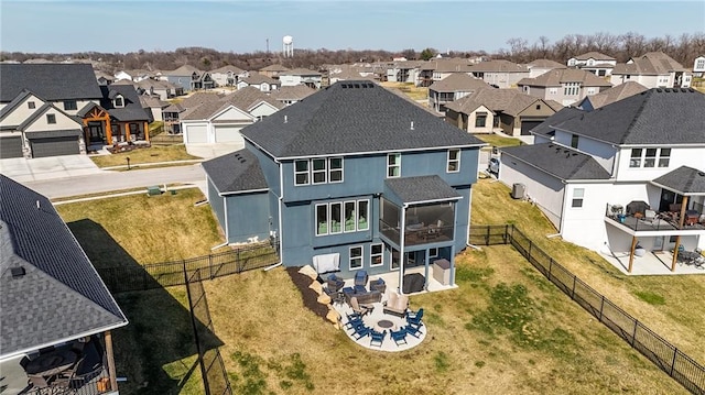 birds eye view of property with a residential view