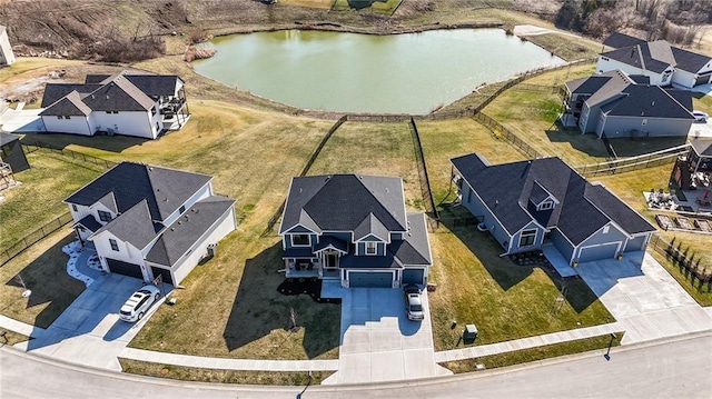 bird's eye view with a residential view and a water view