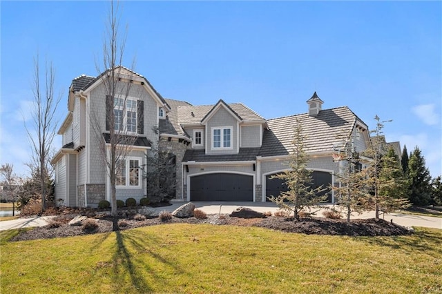 16121 Paradise St, Overland Park, KS 66221 - view of front facade featuring stone siding, a front lawn, concrete driveway, an attached garage, and a garage