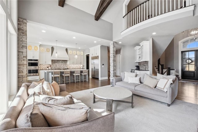 16121 Paradise St, Overland Park, KS 66221 - living room featuring wood finished floors, recessed lighting, high vaulted ceiling, and beam ceiling