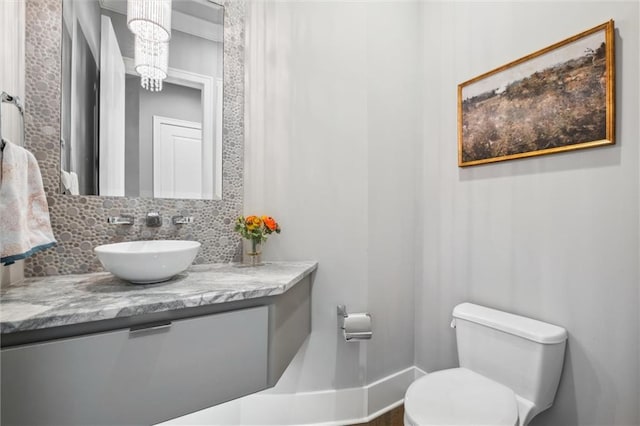 16121 Paradise St, Overland Park, KS 66221 - bathroom with vanity and decorative backsplash