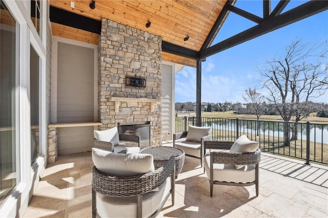 16121 Paradise St, Overland Park, KS 66221 - view of patio / terrace with a water view and an outdoor living space with a fireplace