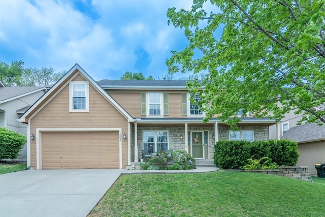 traditional-style home featuring a garage, covered porch, stone siding, a front yard, and concrete driveway