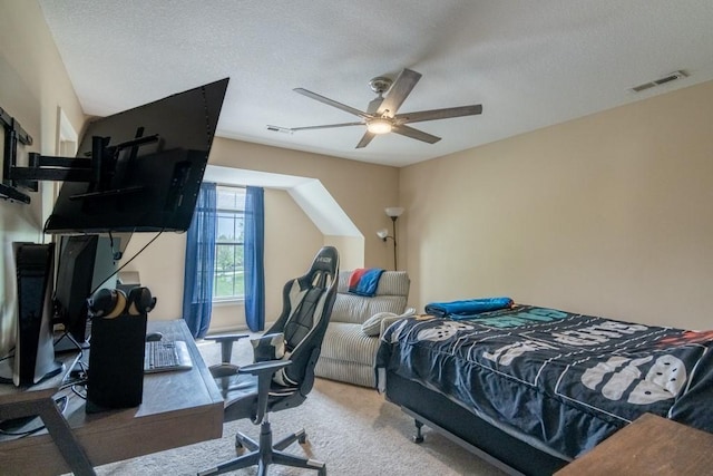 bedroom with carpet floors, a textured ceiling, visible vents, and ceiling fan