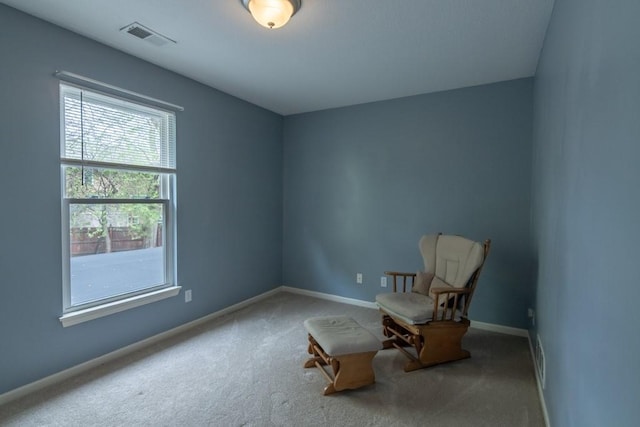 unfurnished room featuring baseboards, carpet, and visible vents