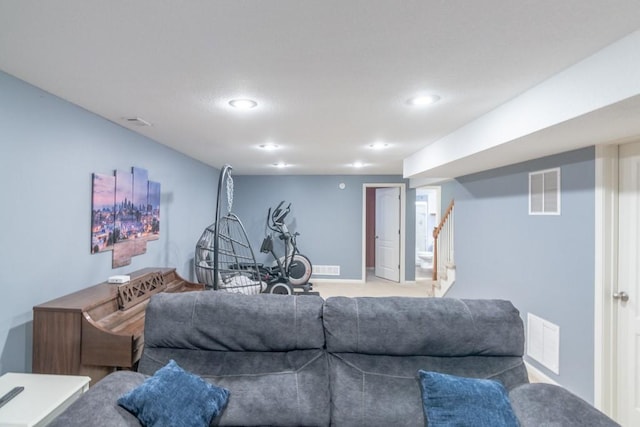 living room with visible vents, recessed lighting, and stairway