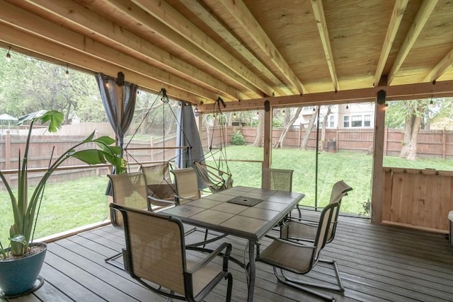 sunroom / solarium with outdoor dining space
