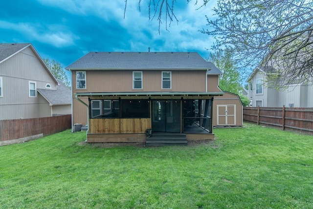rear view of property with a sunroom, a fenced backyard, and a yard