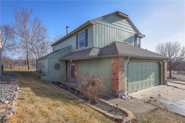 view of side of property with brick siding, a garage, concrete driveway, and roof with shingles