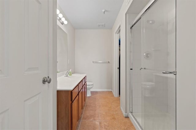 5501 NE 80th Ter Unit 3A, Kansas City, MO 64119 - bathroom with vanity, a stall shower, visible vents, and toilet