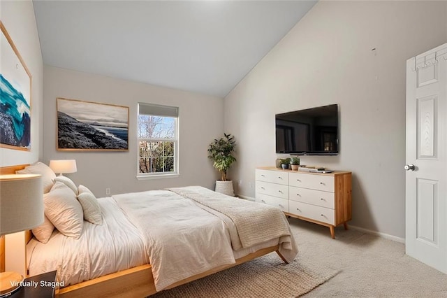 5501 NE 80th Ter Unit 3A, Kansas City, MO 64119 - bedroom with baseboards, high vaulted ceiling, and light colored carpet