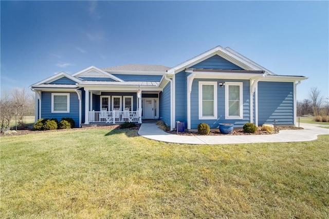 single story home featuring covered porch and a front lawn