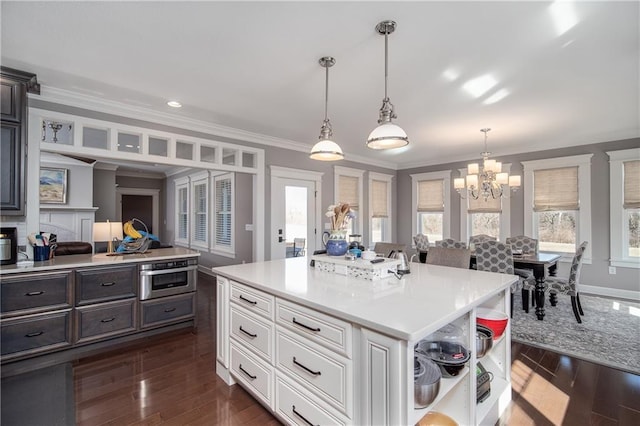 kitchen featuring ornamental molding, open shelves, white cabinetry, light countertops, and dark wood-style flooring