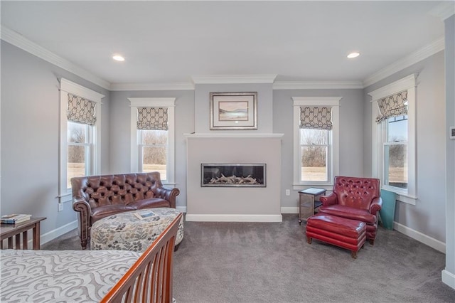 carpeted bedroom featuring a glass covered fireplace, baseboards, and ornamental molding