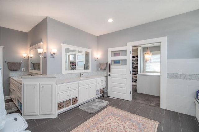 bathroom with double vanity and a sink