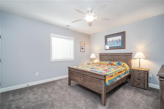 carpeted bedroom featuring ceiling fan and baseboards