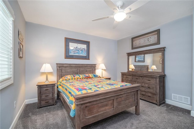 carpeted bedroom featuring visible vents, a ceiling fan, and baseboards