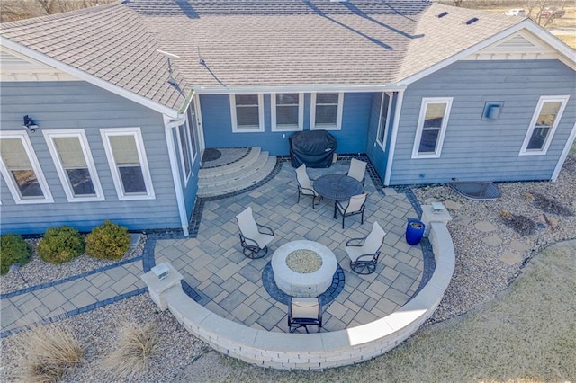 view of patio with a fire pit