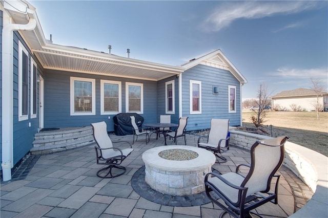 view of patio / terrace featuring an outdoor fire pit