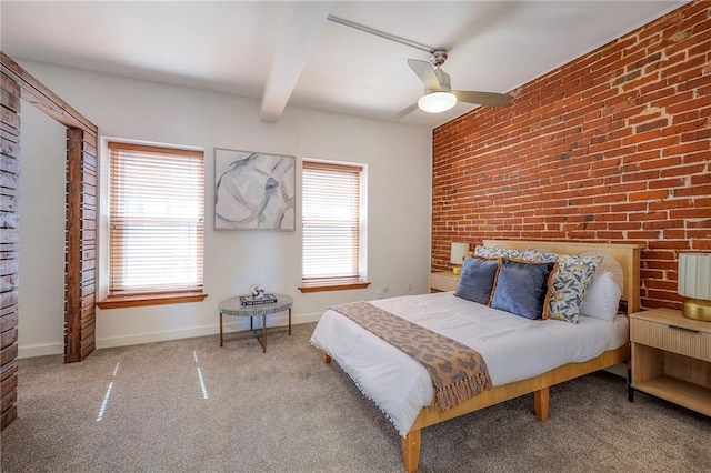 carpeted bedroom with beamed ceiling, ceiling fan, brick wall, and baseboards