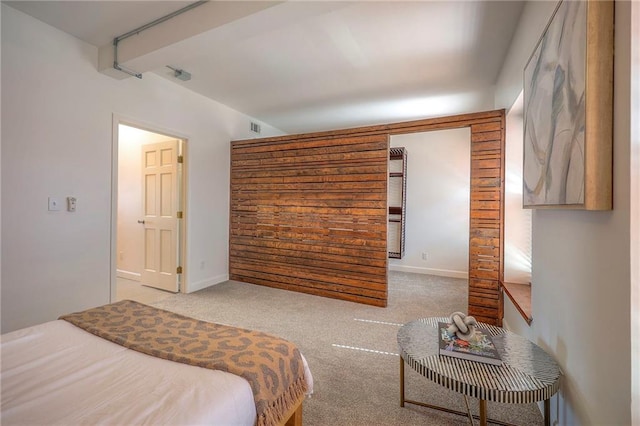 carpeted bedroom featuring visible vents