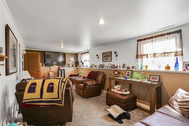 living area with carpet flooring and visible vents