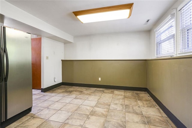 empty room featuring baseboards