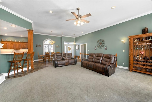 living area with crown molding, baseboards, carpet, recessed lighting, and a ceiling fan