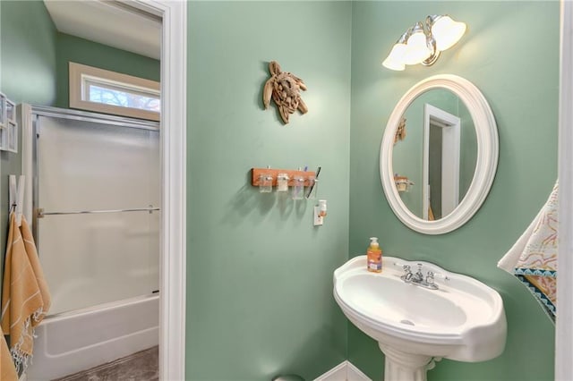 bathroom featuring shower / bathtub combination and a sink