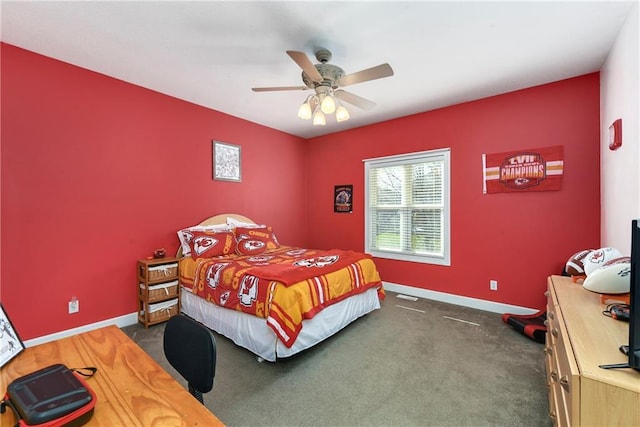 carpeted bedroom featuring baseboards and a ceiling fan