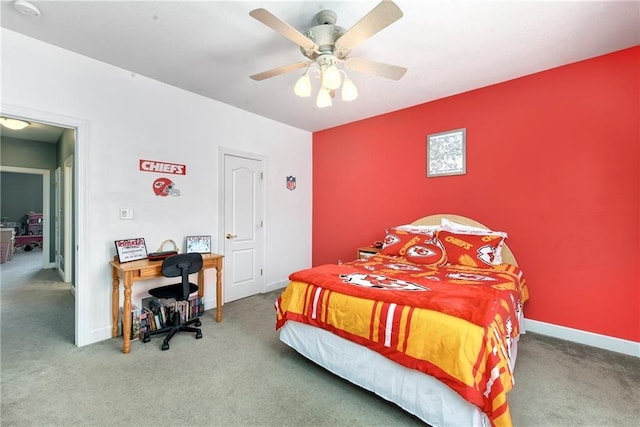 bedroom featuring carpet flooring, a ceiling fan, and baseboards