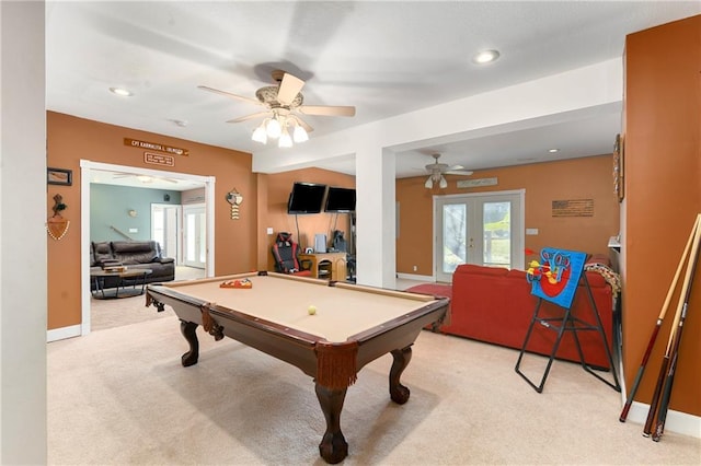 recreation room featuring a ceiling fan, baseboards, pool table, french doors, and light colored carpet