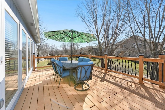 wooden deck with outdoor dining space