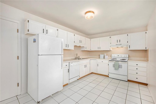 kitchen with white appliances, a sink, light countertops, under cabinet range hood, and white cabinetry