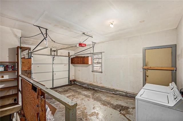 garage featuring washing machine and dryer and a garage door opener