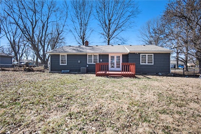 back of house with fence, a yard, central AC, french doors, and a deck