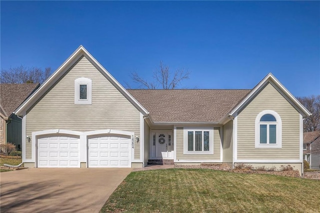 view of front facade with a garage, a front lawn, and driveway