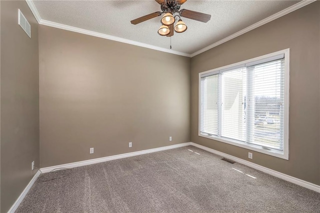 spare room featuring visible vents, crown molding, baseboards, carpet flooring, and a textured ceiling